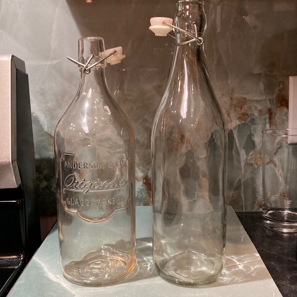Set of 2 vintage glass, flip top bottles